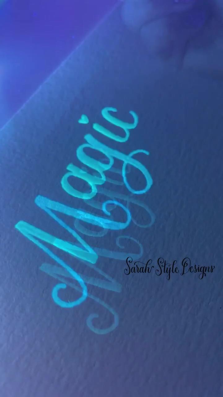 Glowing glass dip pen; floral card with calligraphy 