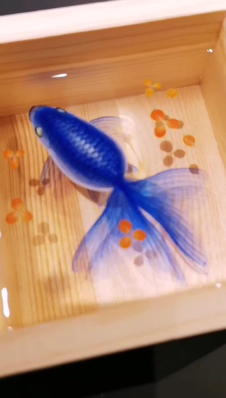 Capturing the beauty of the deep blue sea: a stunning goldfish resin painting in a wooden box; gold leaf art