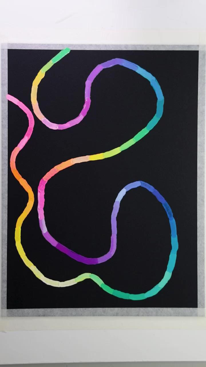 Colorful gouache squiggle on black | add a chain stitch to a swaddle blanket for an easy baby gift