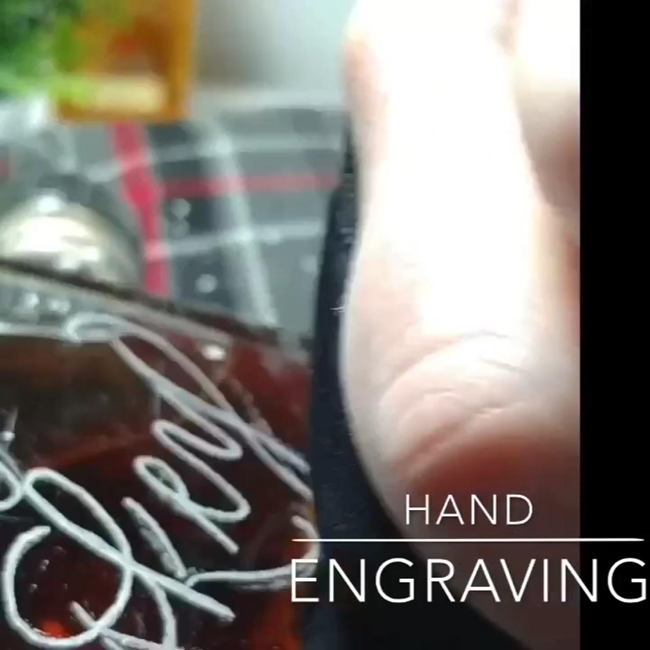 Hand engraving a whiskey bottle; amazing kinetic sand sculpture