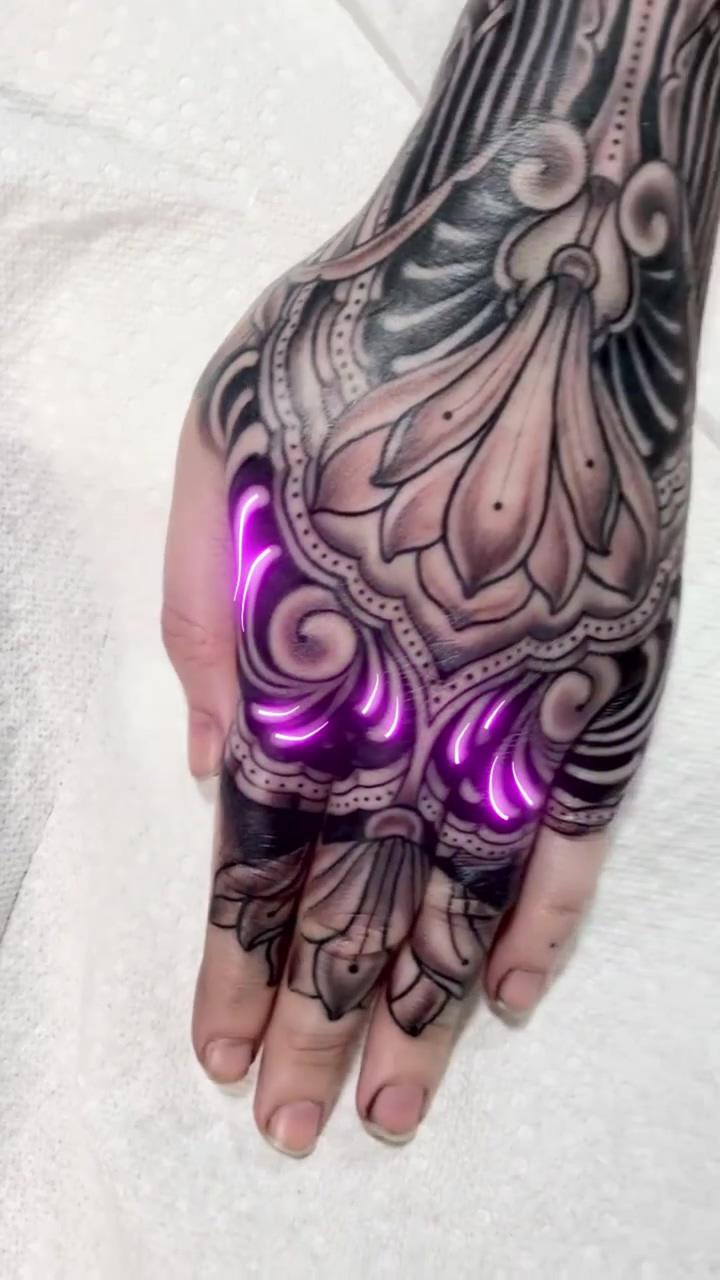 Hand tattoo; glow tattoo