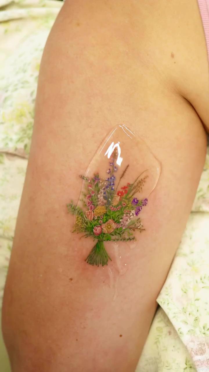 Small flower tattoo; realistic tattoo ideas