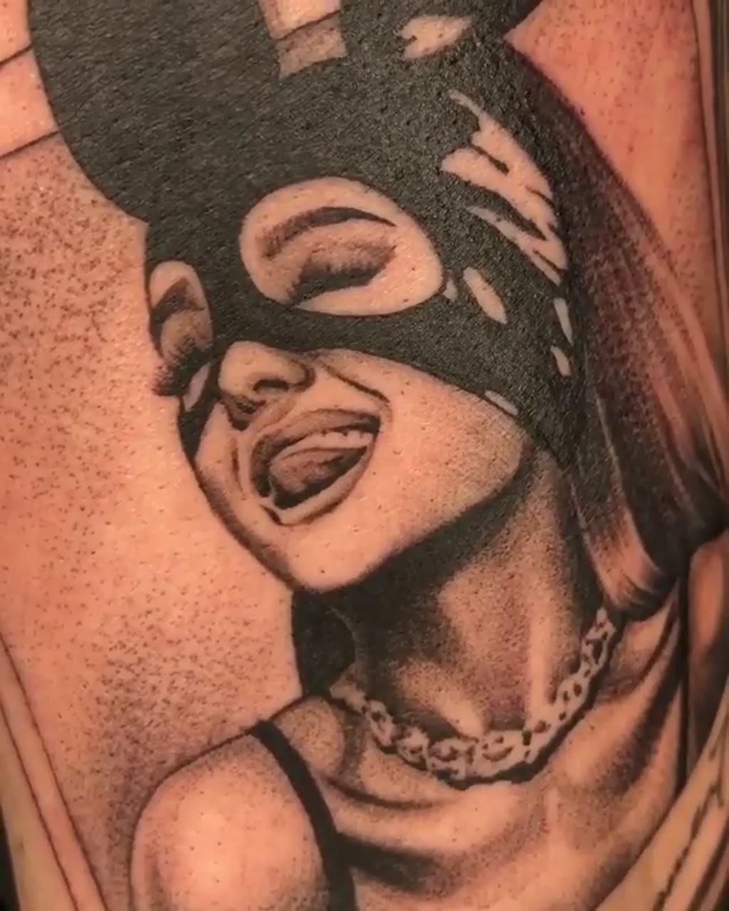 Ariana grande portrait black and grey tattoo; star tattoo on hand