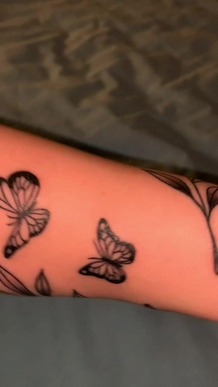 Butterflies and wrapping vine tattoo; balinesbarongmasktattoo yantino tattoo ubud bali