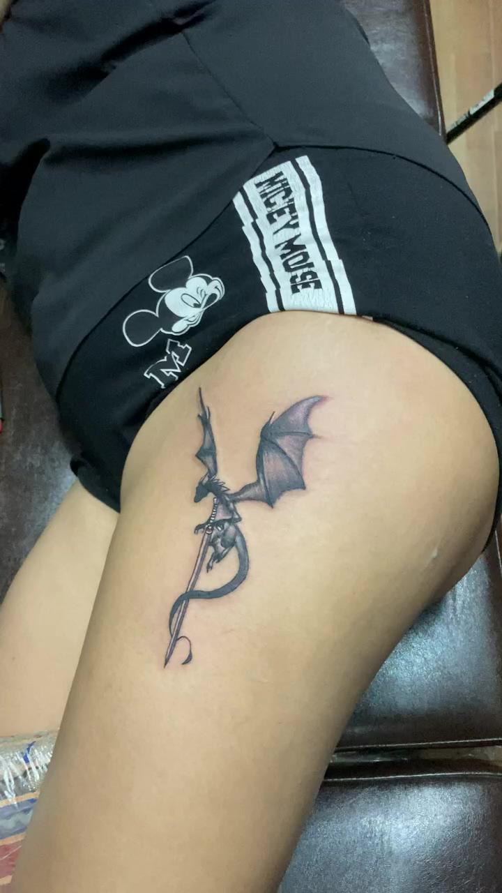 Dragon tattoo; dragon tattoo with sword