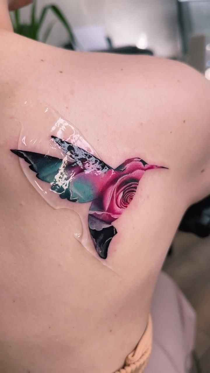 High quality tattoo. mother-of-pearl rose in the shape of a hummingbird; butterfly tattoo