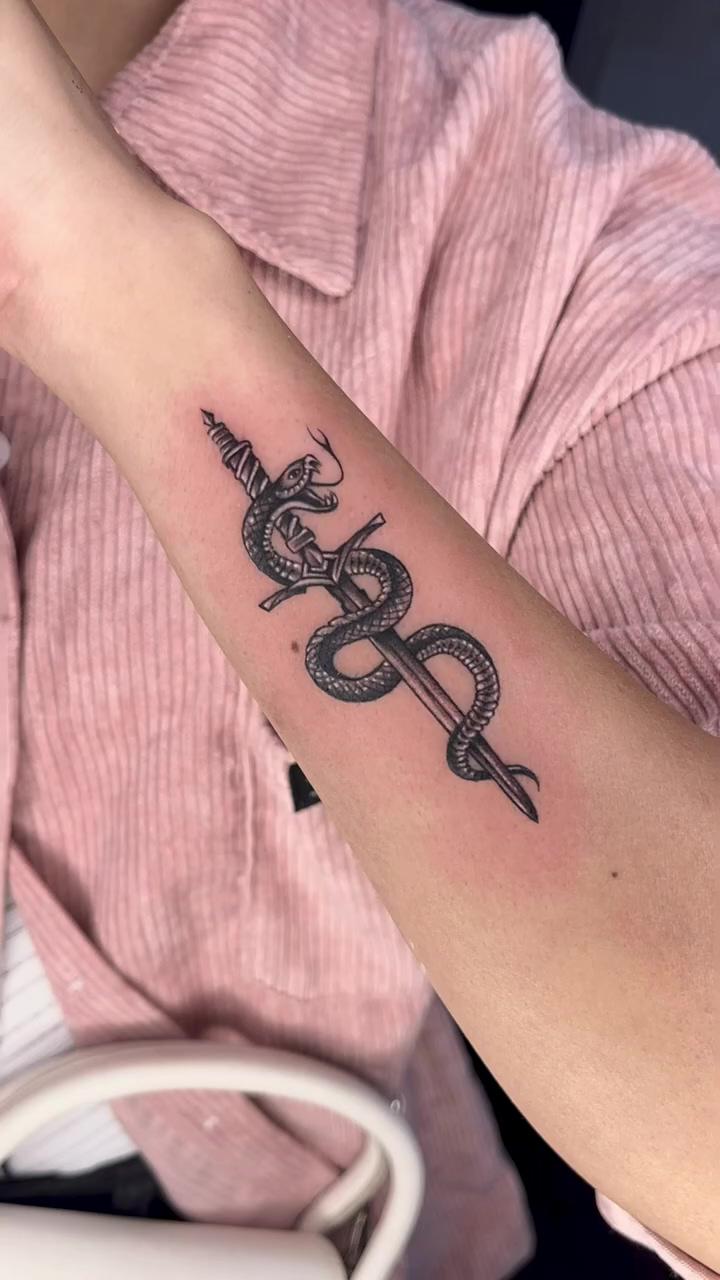Snake and sword tattoo by : kaptaan tattoo; tattooing font lettering w  7rl 