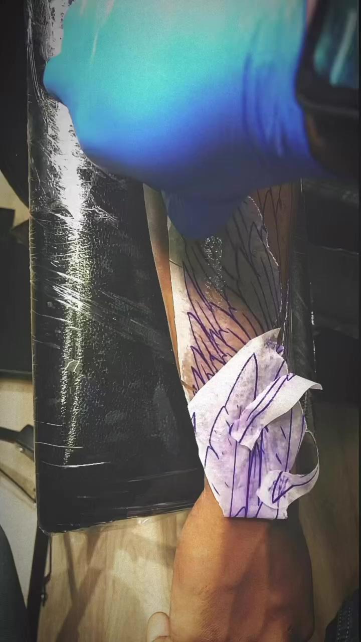 Wing tattoo, forearm tattoo, deep sign tattoos; tattoo ink