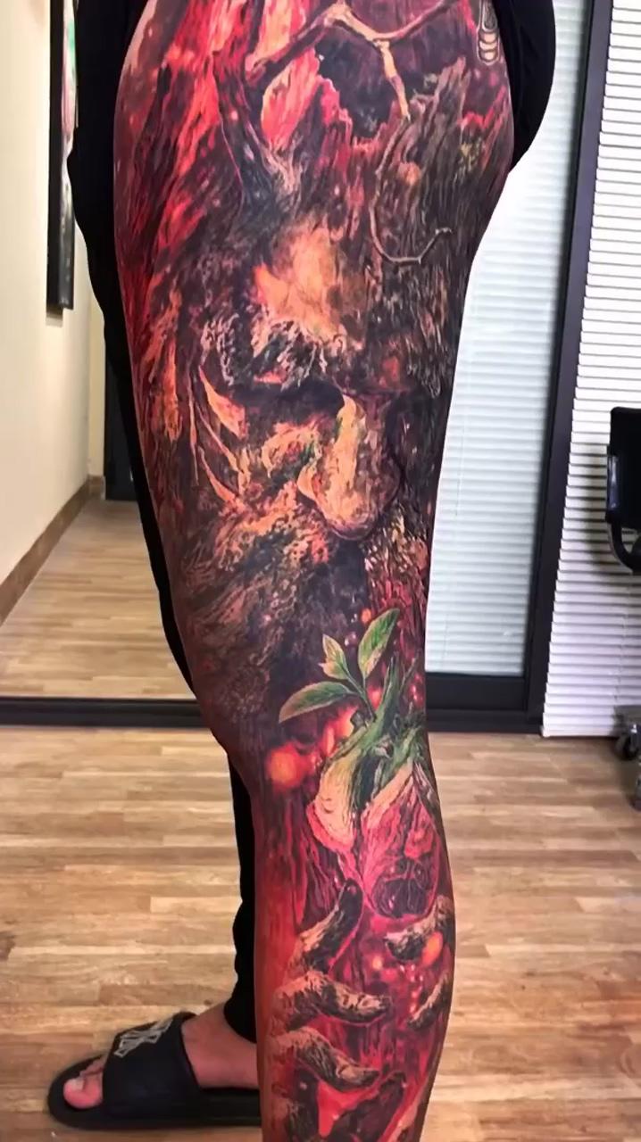 Full thigh tattoo; henna arm tattoo