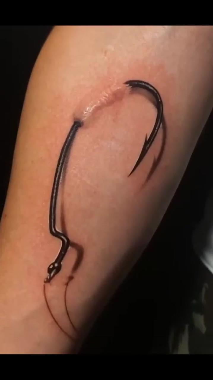 Hooked on ink: the ultimate fishing-hook 3d tattoo; 3d tattoo
