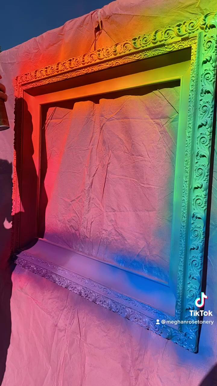 Neon rainbow picture frame; toy box - the balance between work and play